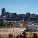 Downtown Denver skyline with skyscrapers under blue sky