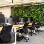 Modern office with desks and ergonomic chairs, representing business equipment and furniture subject to property tax